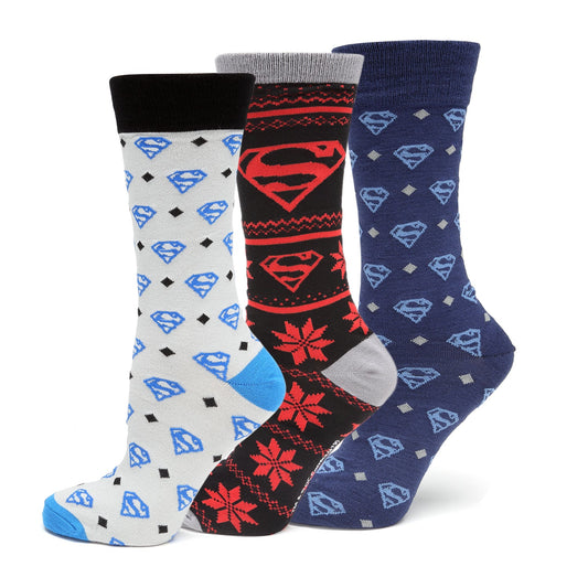 Three pairs of socks with Superman logo patterns on a white background