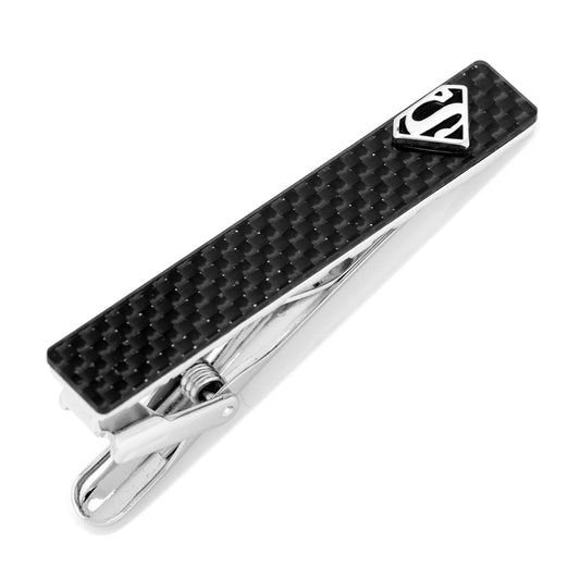 Carbon fiber tie clip with Superman logo on a white background