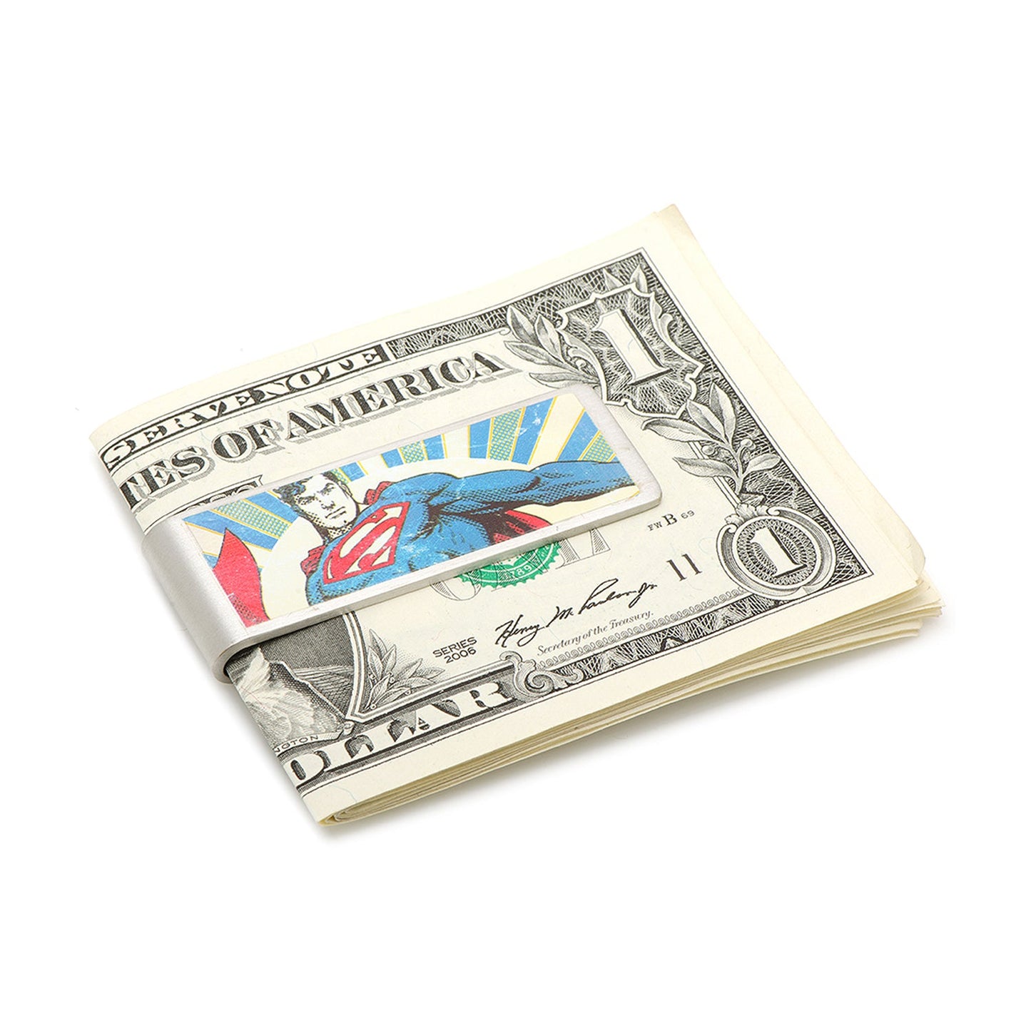 Superman-themed money clip on a dollar bill against a white background