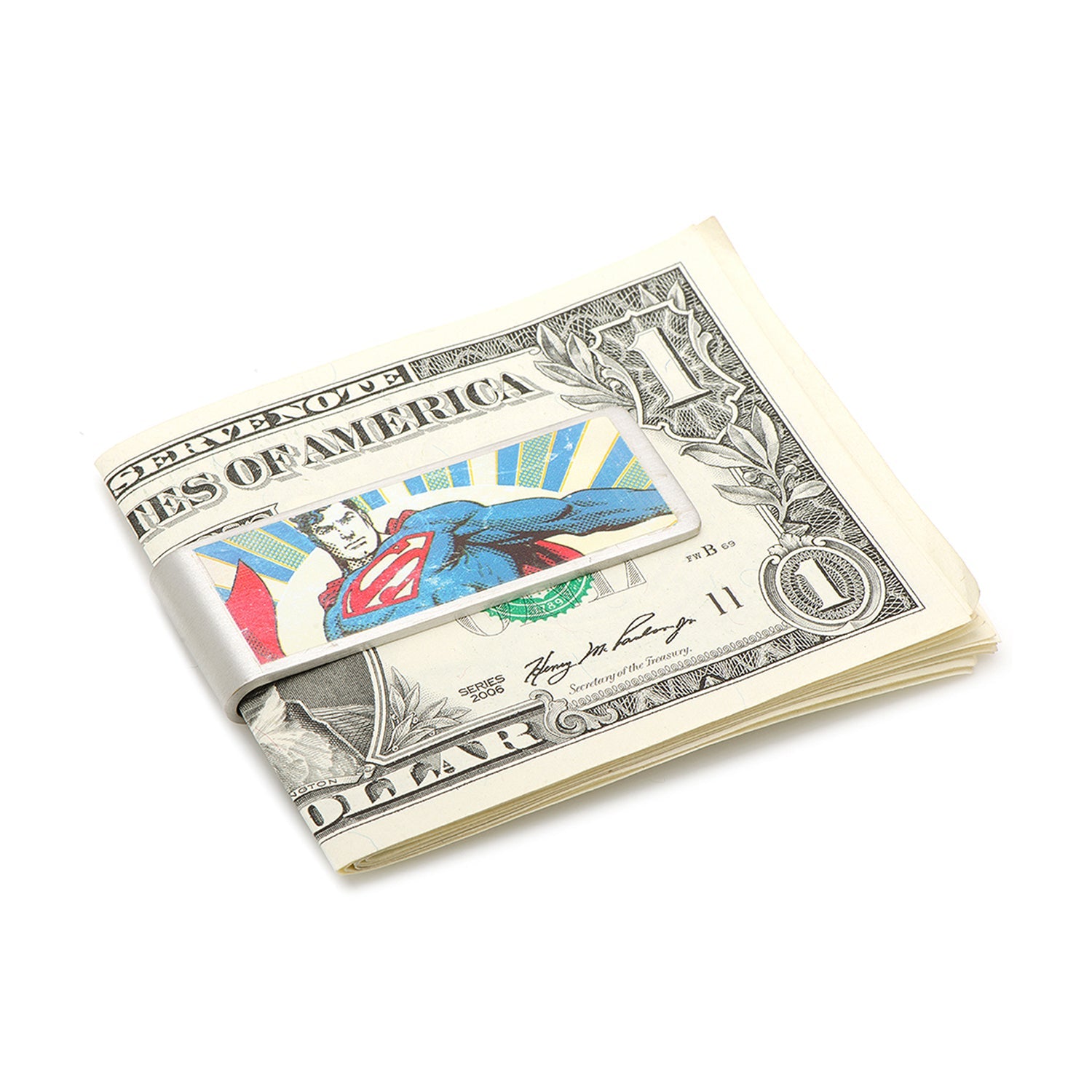 Superman-themed money clip on a dollar bill against a white background
