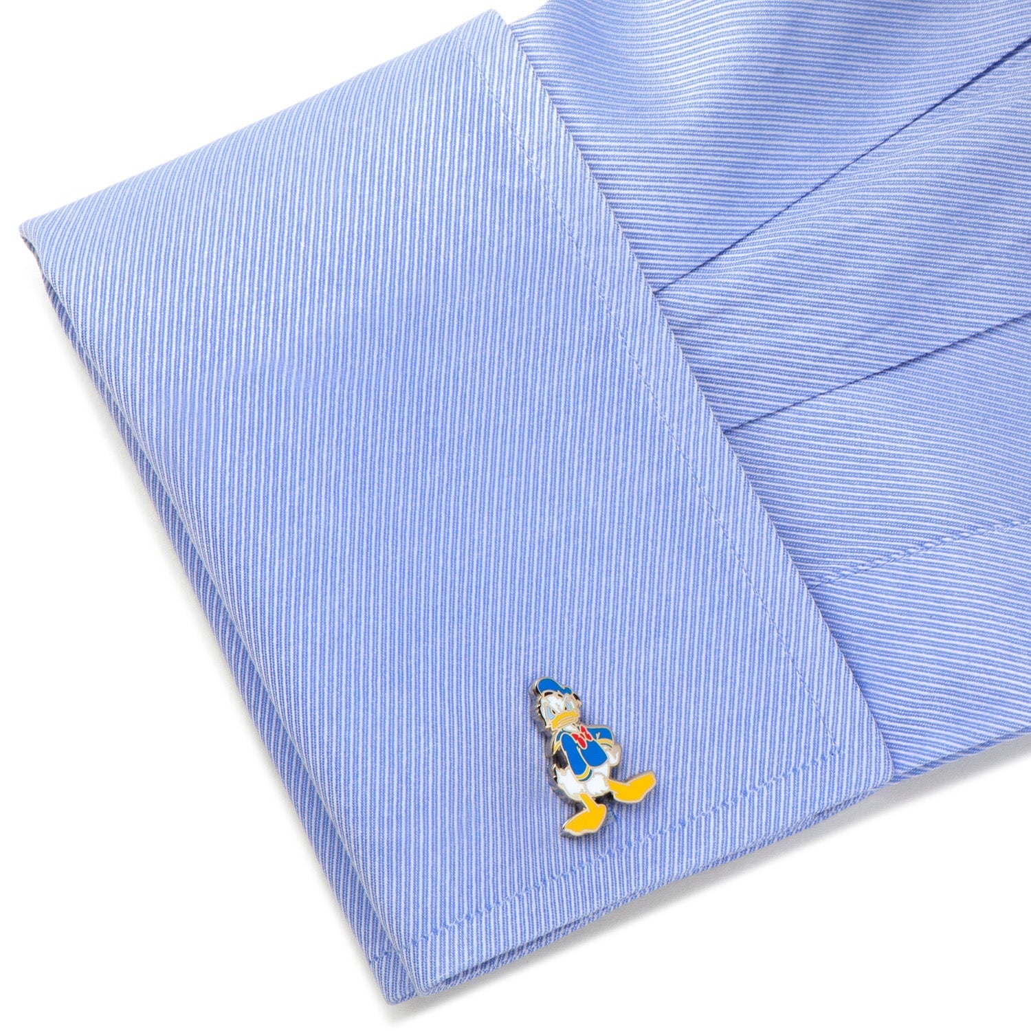 Blue striped shirt with a Donald Duck pin on a white background