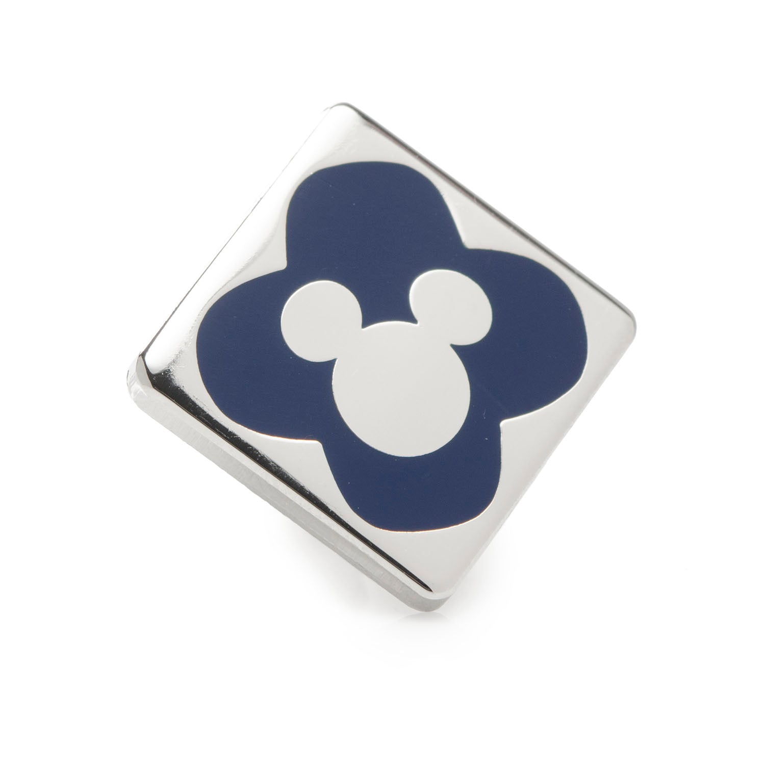 Square metal pin with blue flower and white center on a white background