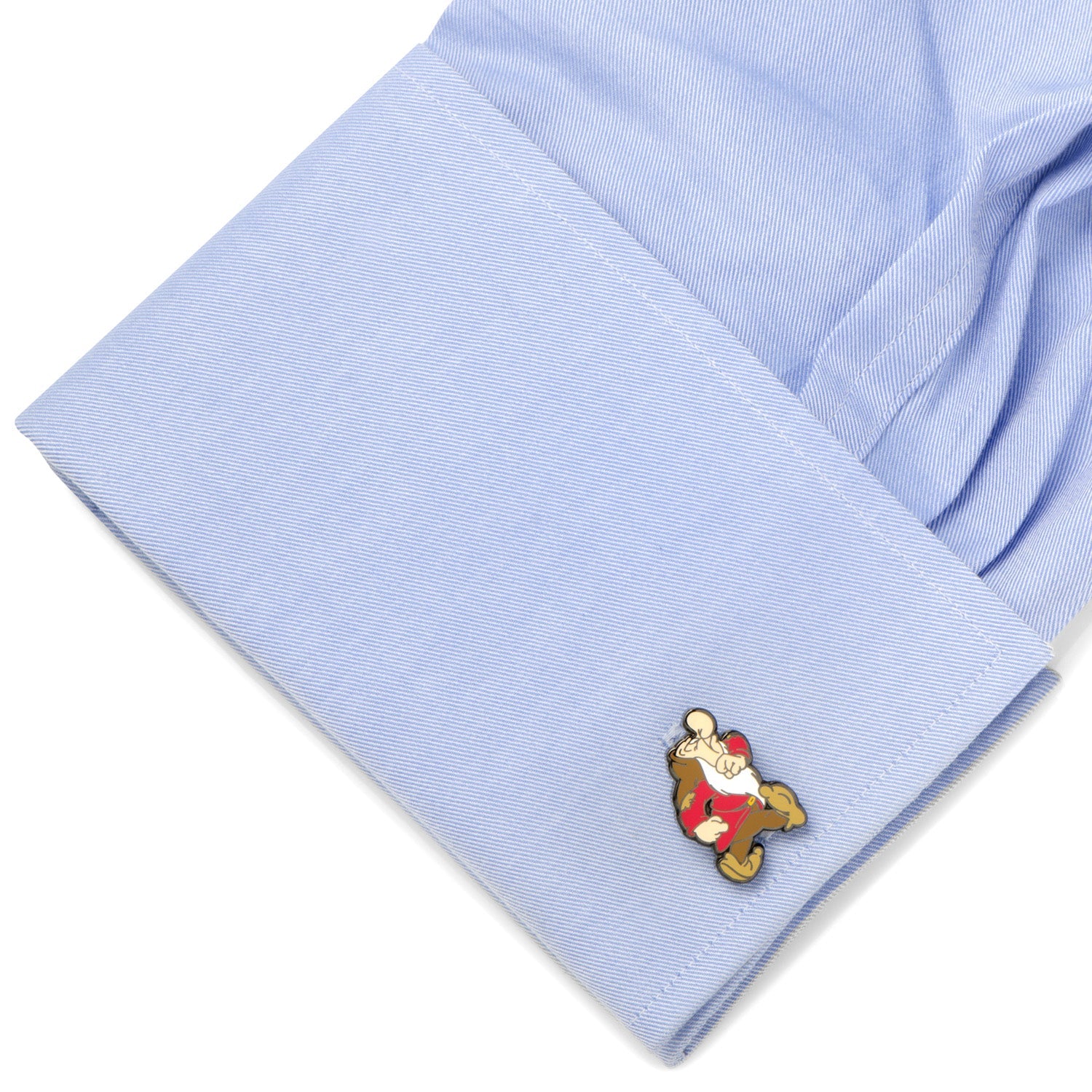 Cufflink with a cartoon character on a light blue shirt sleeve