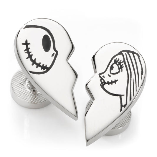 Silver heart-shaped cufflinks with cartoon faces on a white background