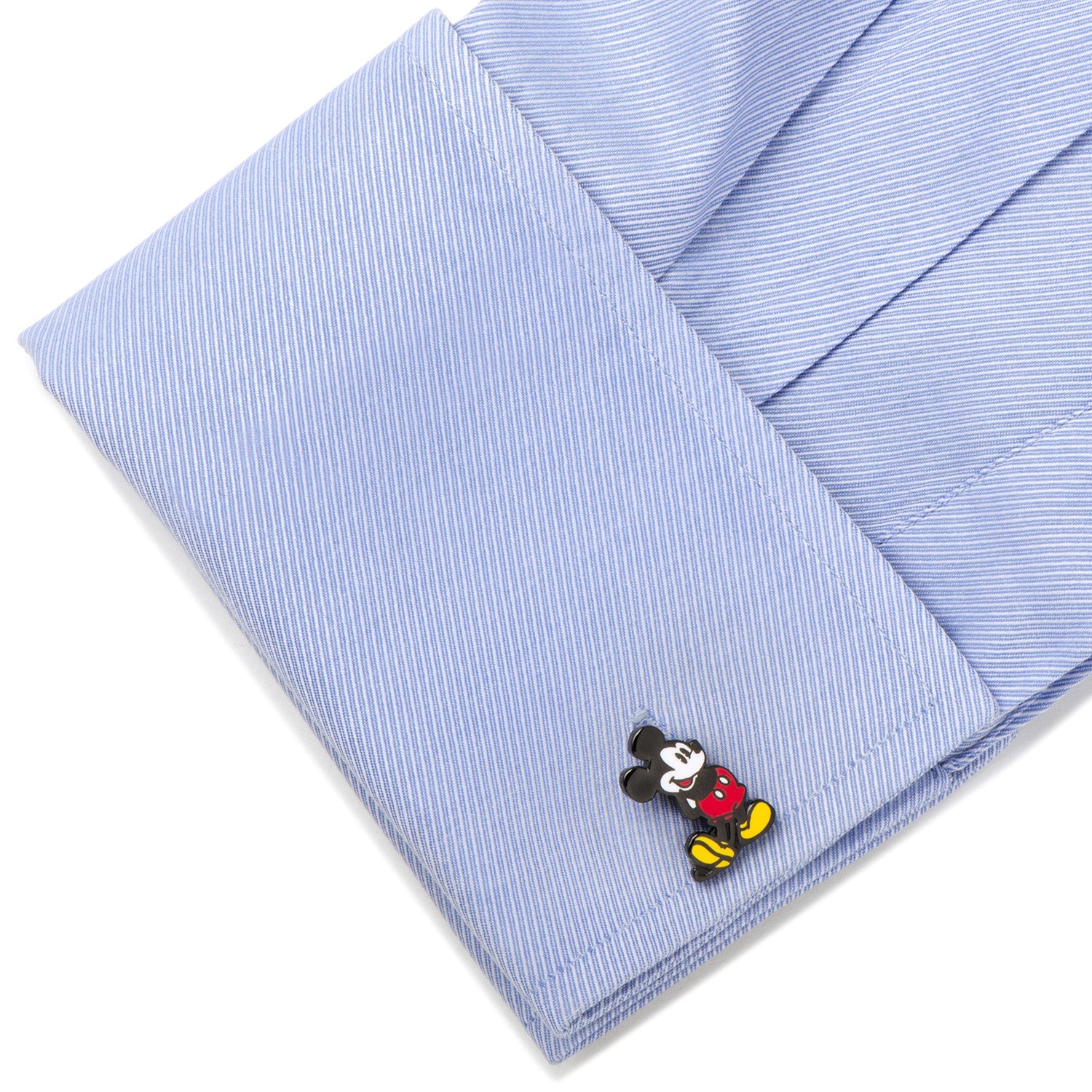 Blue striped shirt with a Mickey Mouse cufflink on a white background