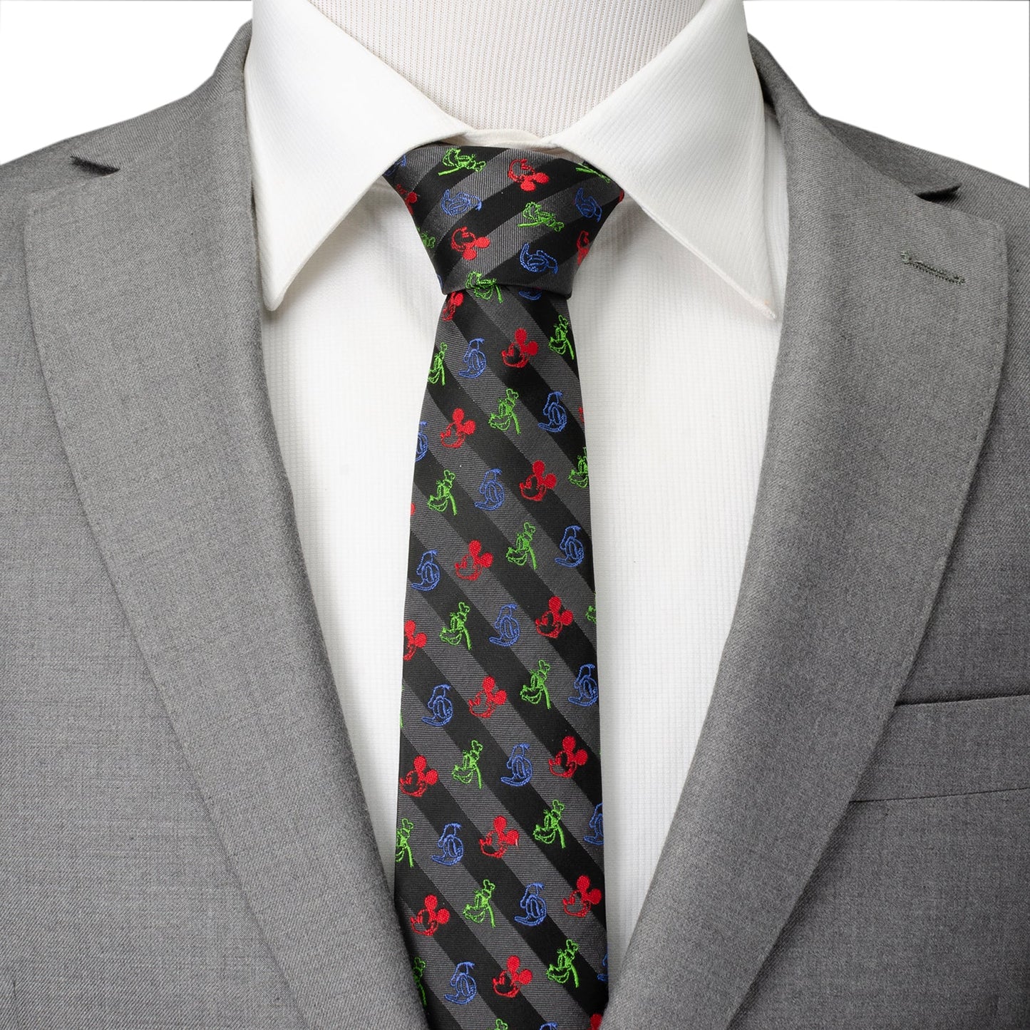 Gray suit with a white shirt and colorful patterned tie on a plain background
