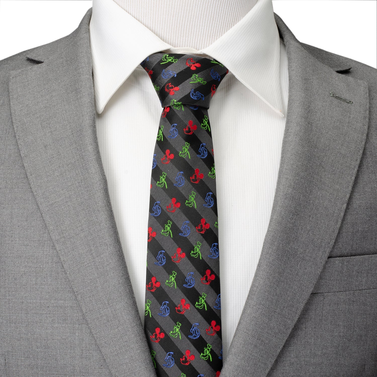 Gray suit with a white shirt and colorful patterned tie on a plain background