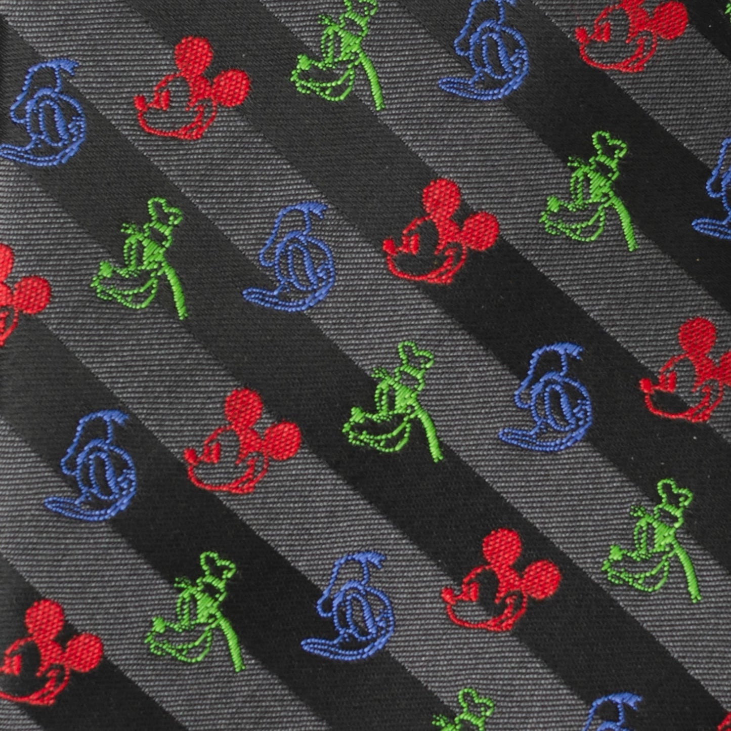 Patterned fabric with colorful embroidered characters on a striped background