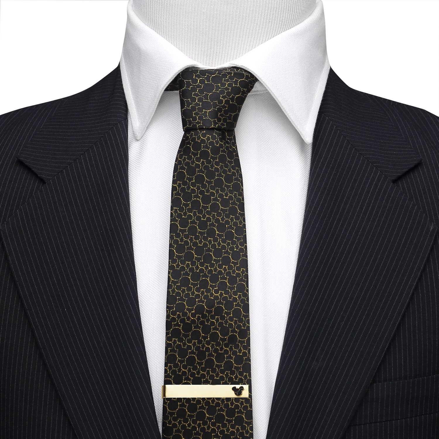 Black patterned tie with gold accents on a suit and white shirt