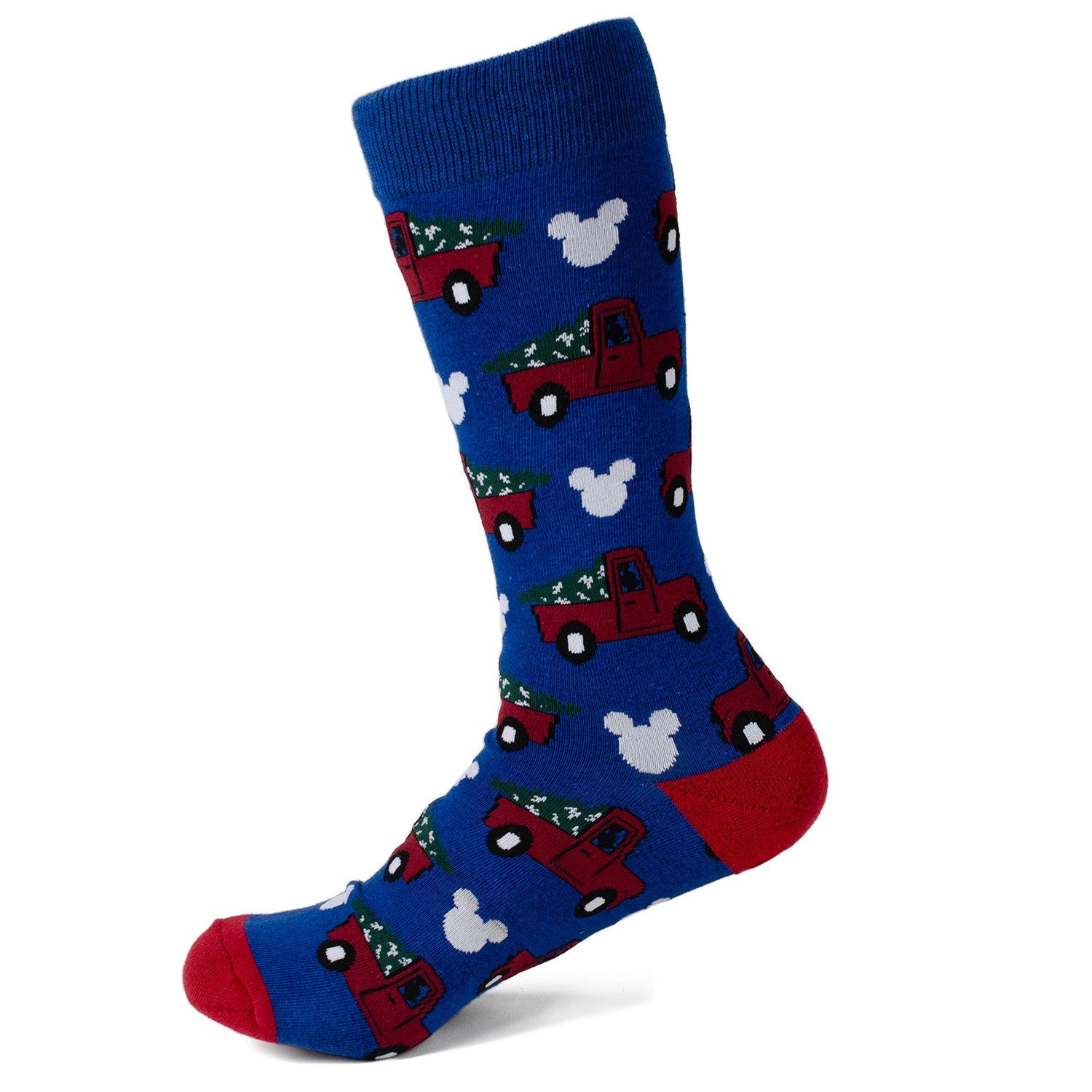 Blue sock with red trucks and white trees pattern on a white background