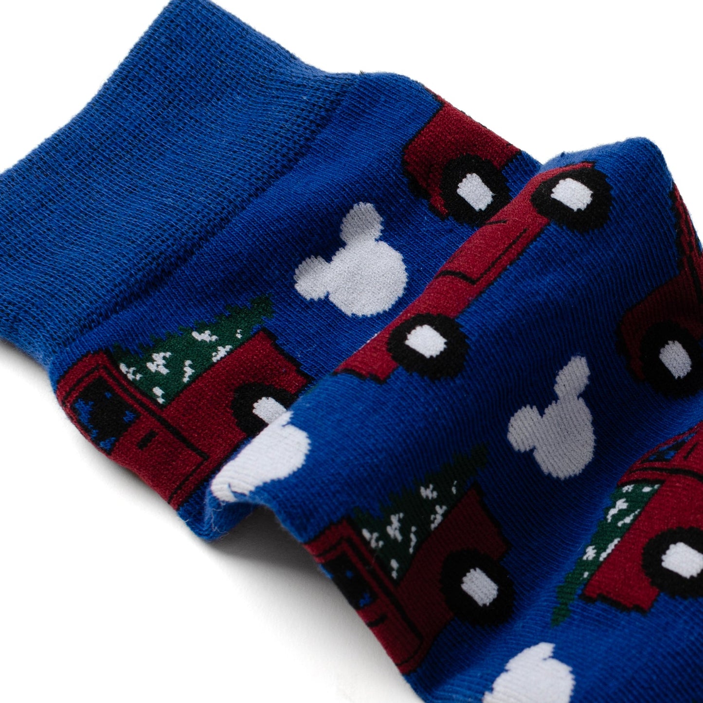 Blue socks with red trucks and white Mickey Mouse heads on a white background