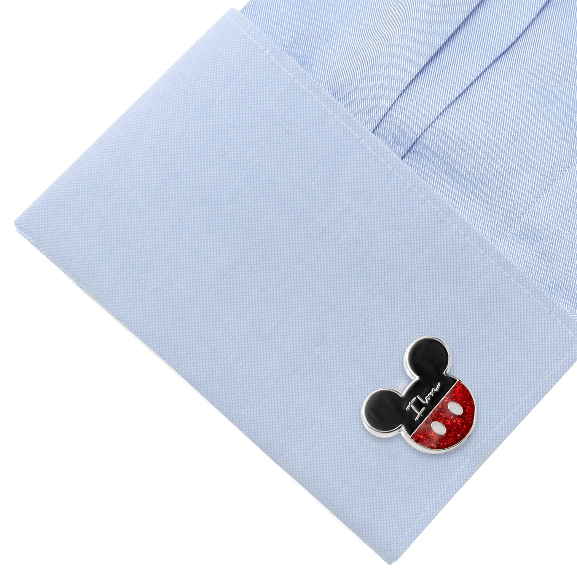 Cufflink with a Mickey Mouse design on a light blue shirt