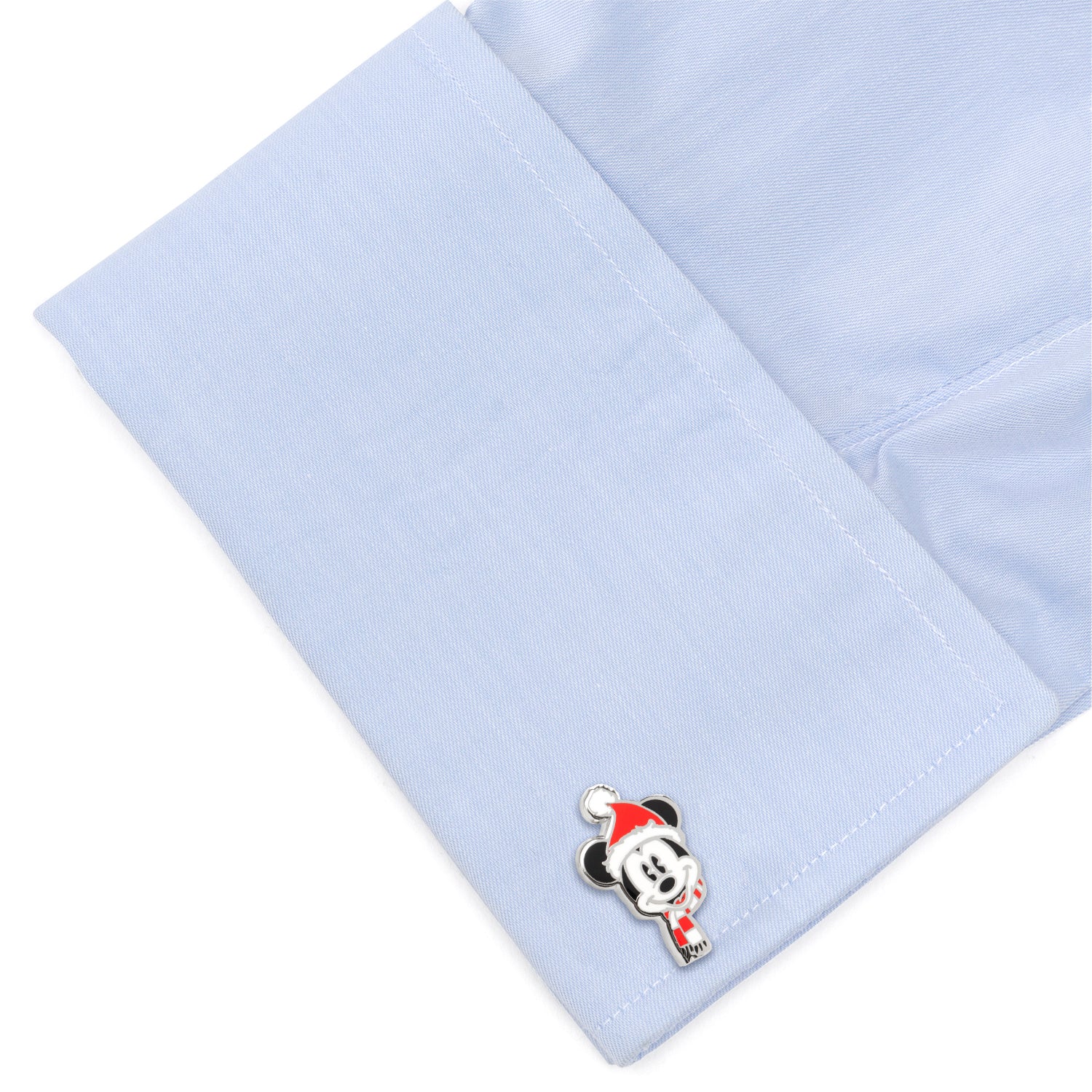 Light blue dress shirt with a cartoon character pin on a white background
