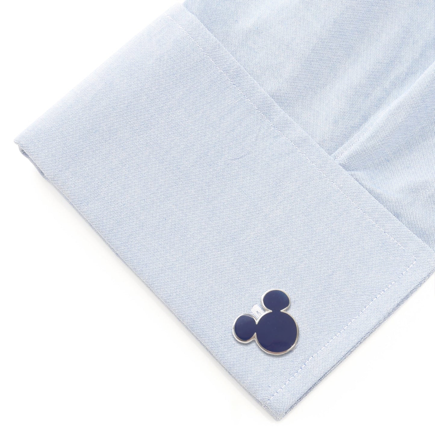 Navy blue Mickey Mouse cufflinks on a light blue dress shirt