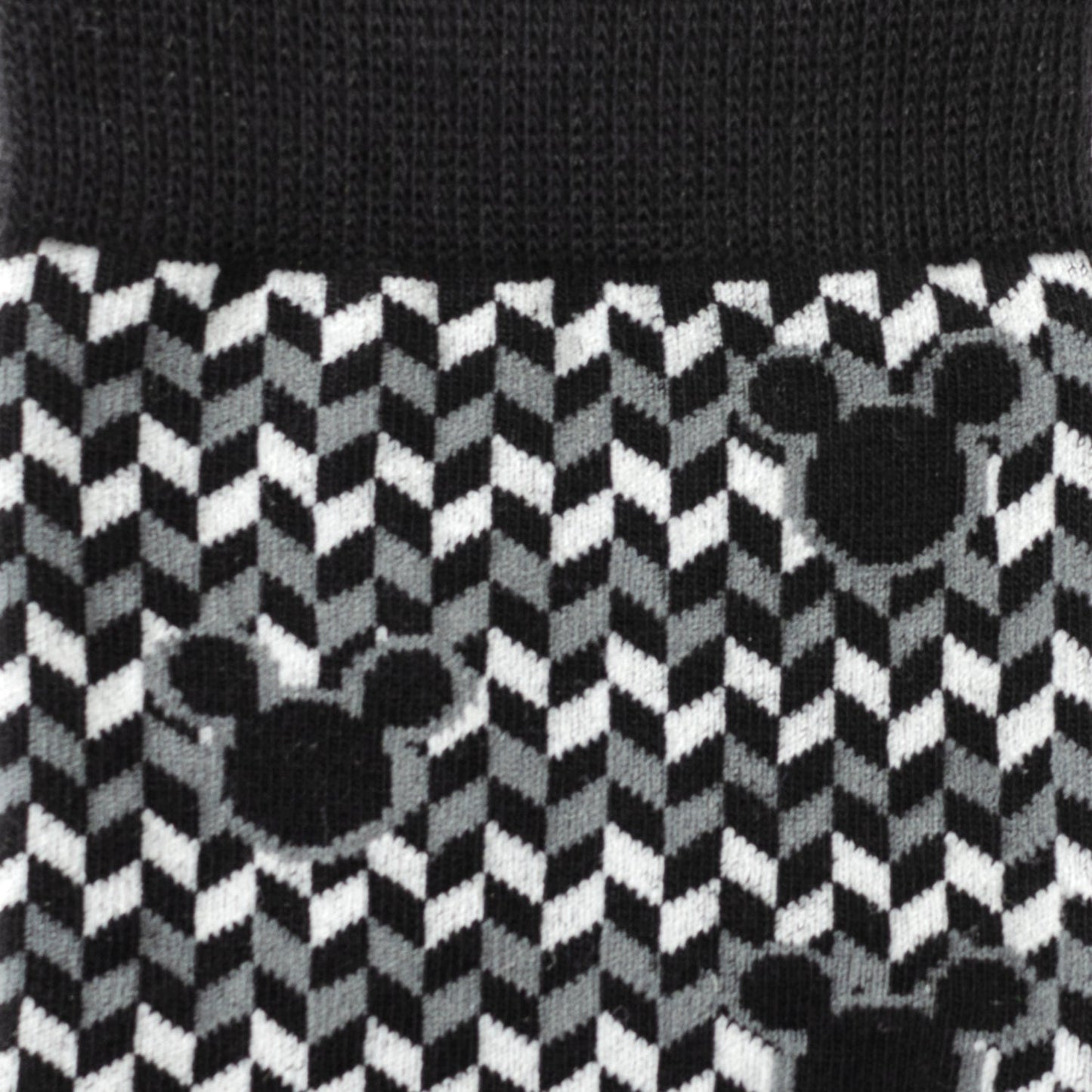 Black and white checkered pattern with Mickey Mouse ears design on a textured background