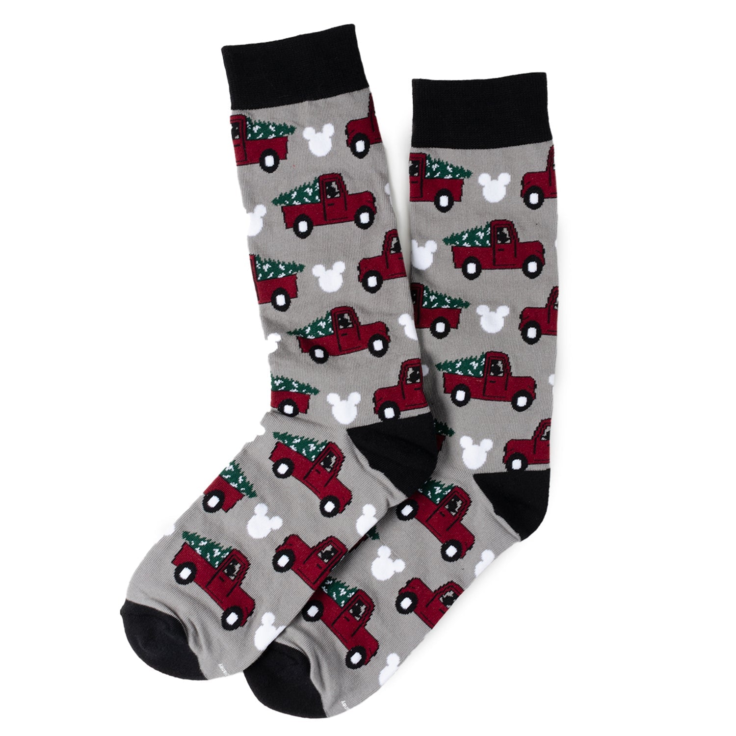 Gray socks with red truck and Christmas tree pattern on a white background