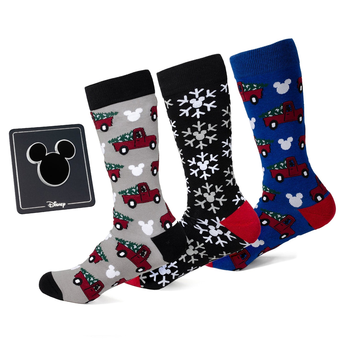 Three pairs of Disney-themed socks with Christmas designs on a white background, featuring the Disney logo.