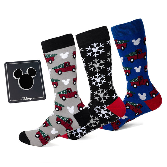 Three pairs of Disney-themed socks with Christmas designs on a white background, featuring the Disney logo.