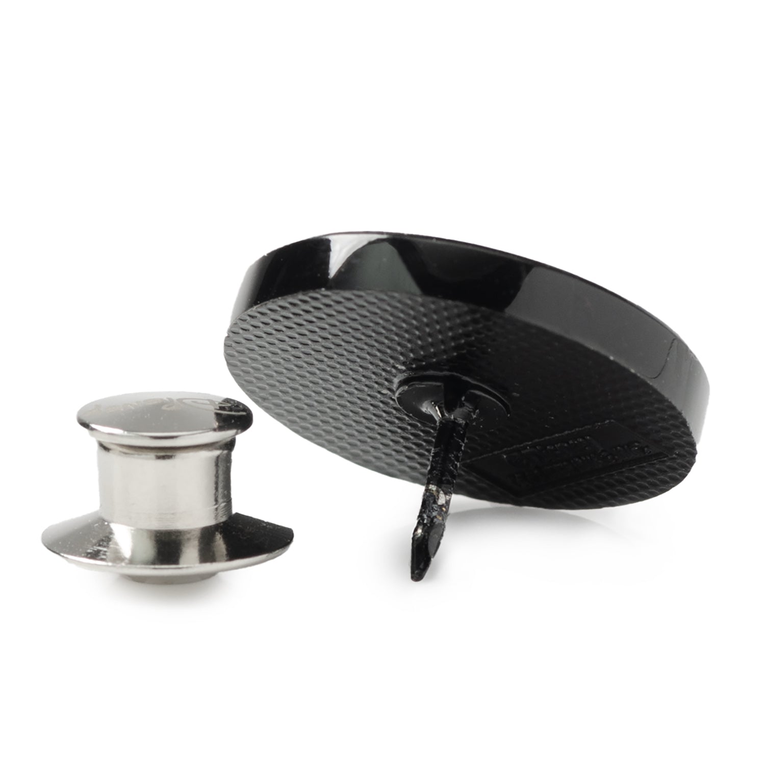 Black and silver metal components on a white background