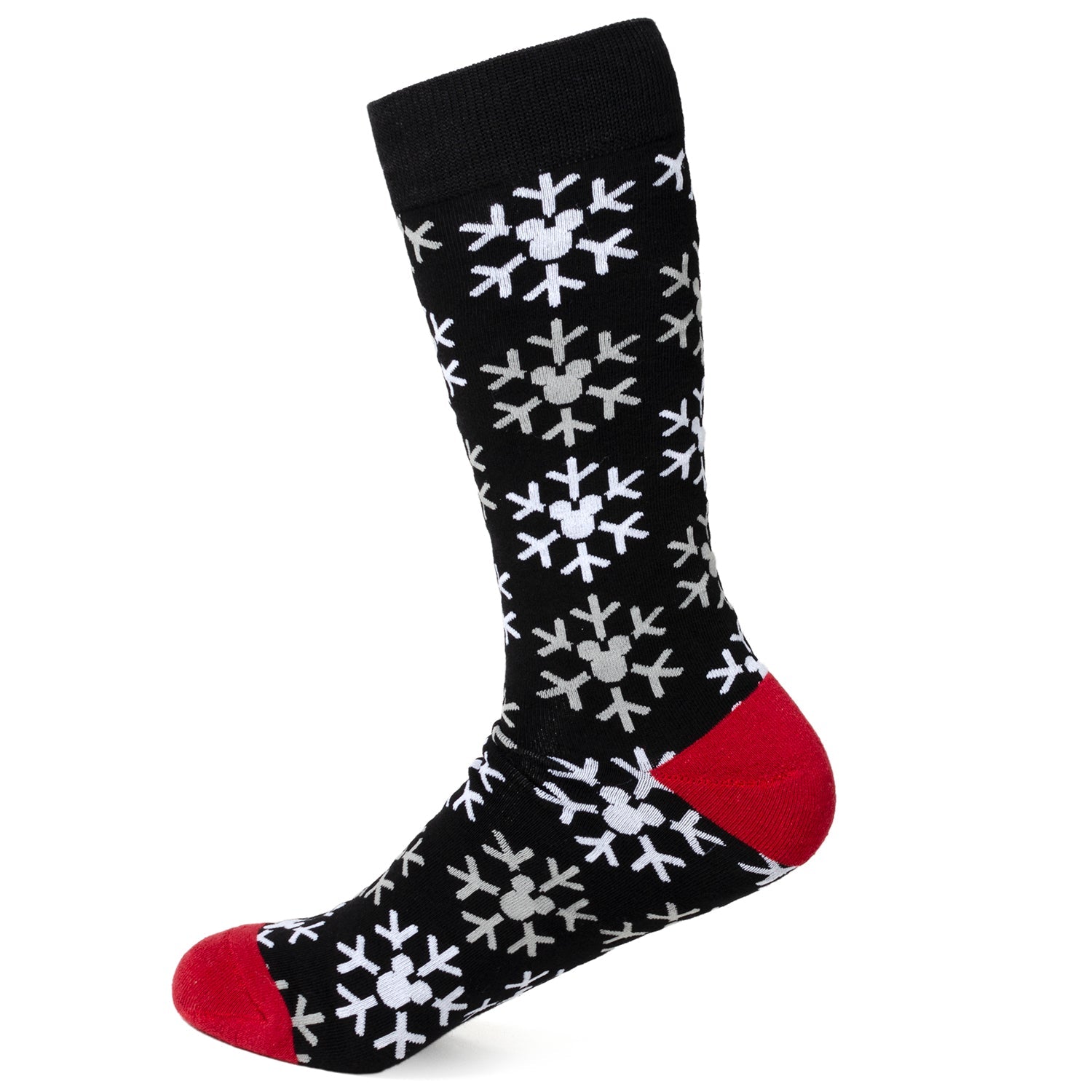 Black sock with white snowflake pattern and red toes on a white background