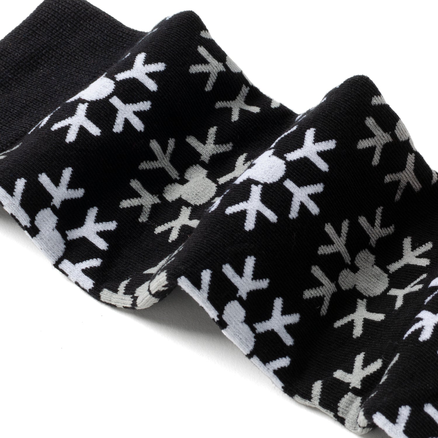 Black socks with white star pattern on a white background