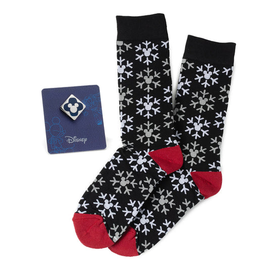 Black socks with white pattern and red toes and cuffs, featuring a Disney card on a white background
