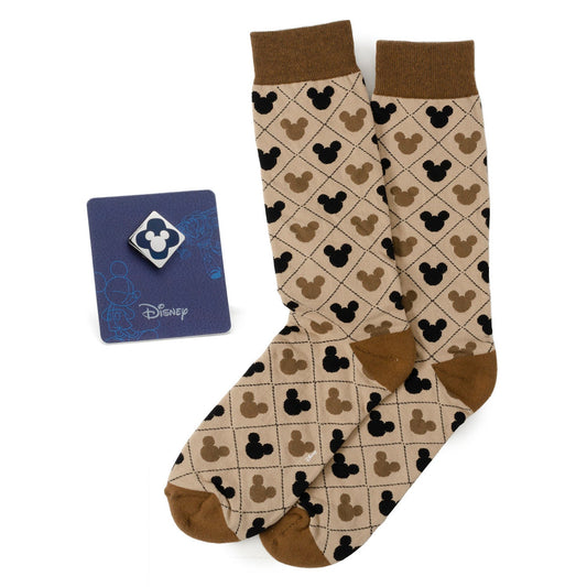 Pair of socks with Mickey Mouse pattern and Disney card on a white background