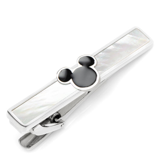 Silver tie clip with black center on a white background