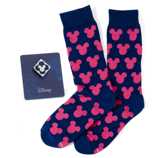 Navy blue socks with pink Mickey Mouse ears pattern and Disney card on a white background