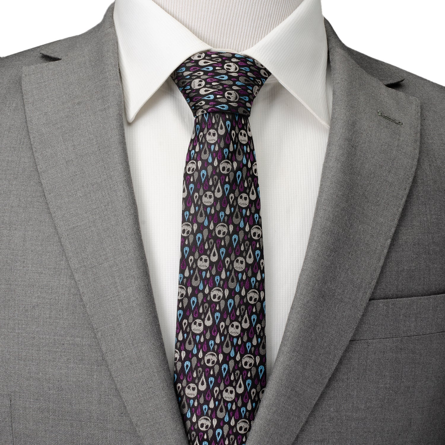 Gray suit with a white shirt and patterned tie on a white background