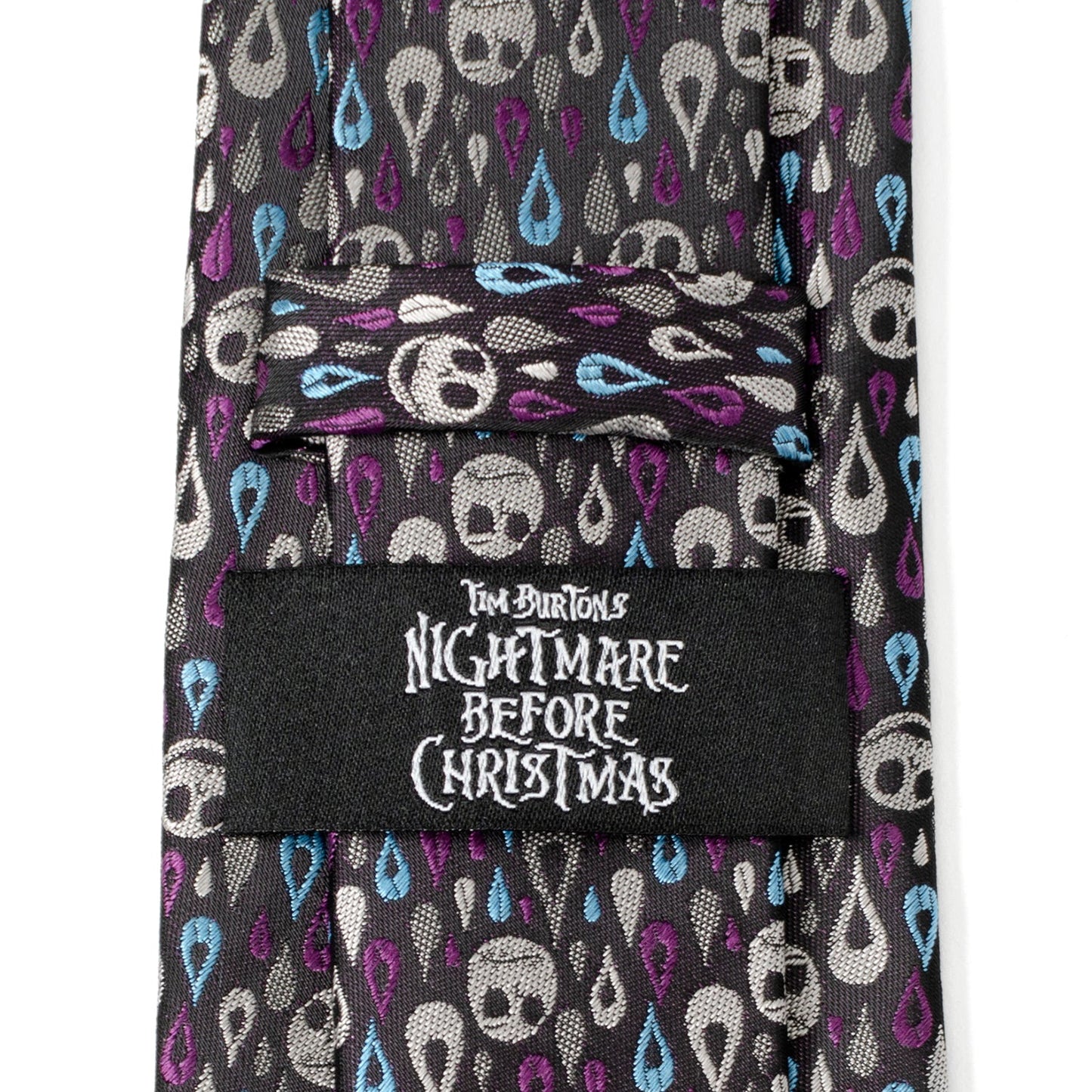 Tie with skull pattern and 'Nightmare Before Christmas' label on a white background