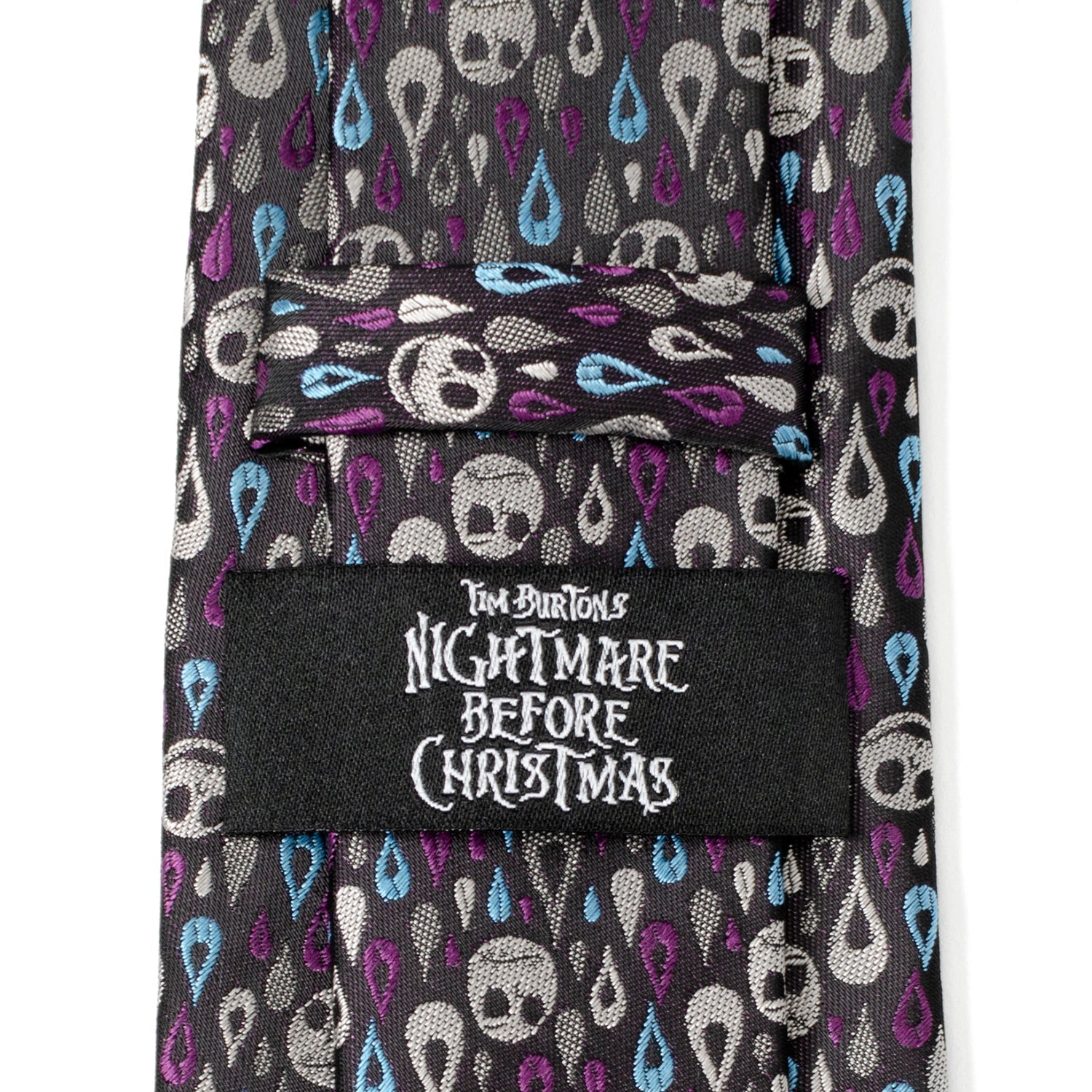 Tie with skull pattern and 'Nightmare Before Christmas' label on a white background