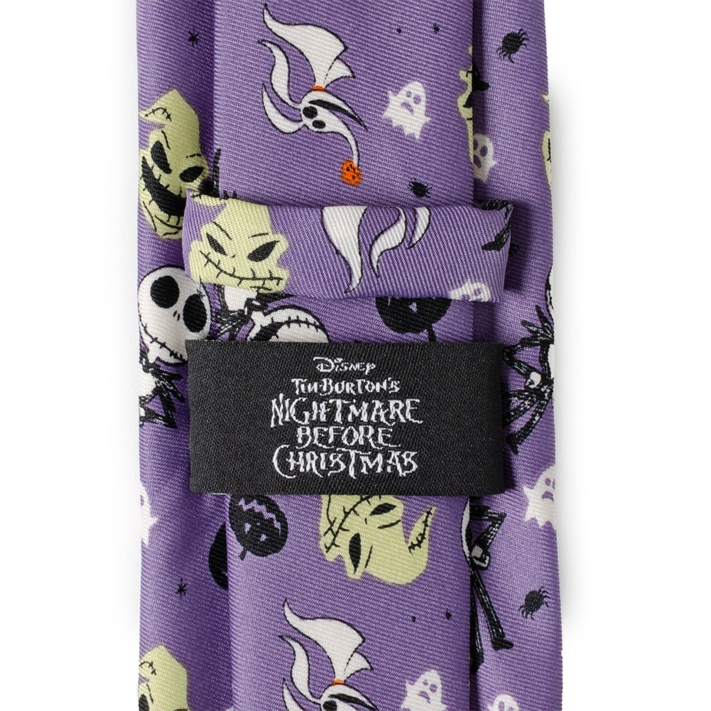 Purple tie with 'Nightmare Before Christmas' character patterns and brand label on a white background