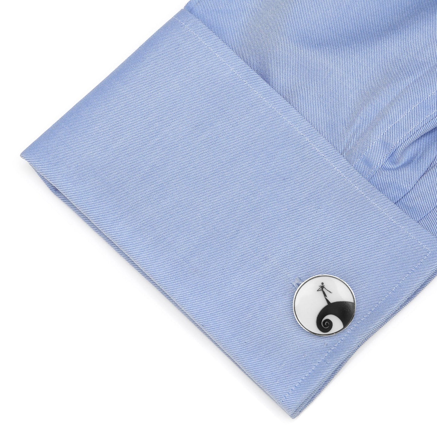 Cufflink on a blue shirt cuff