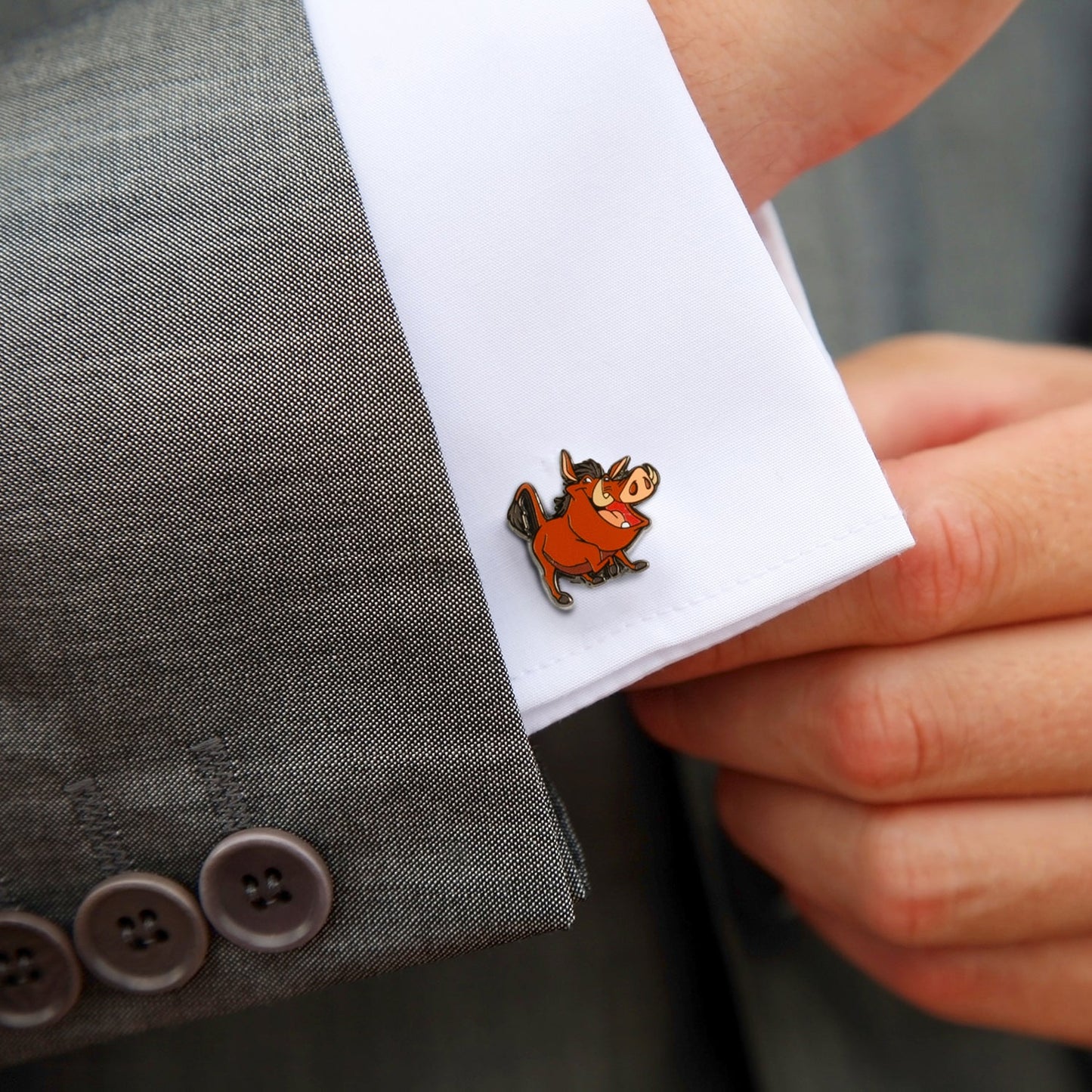 Cufflink with cartoon character on a suit cuff