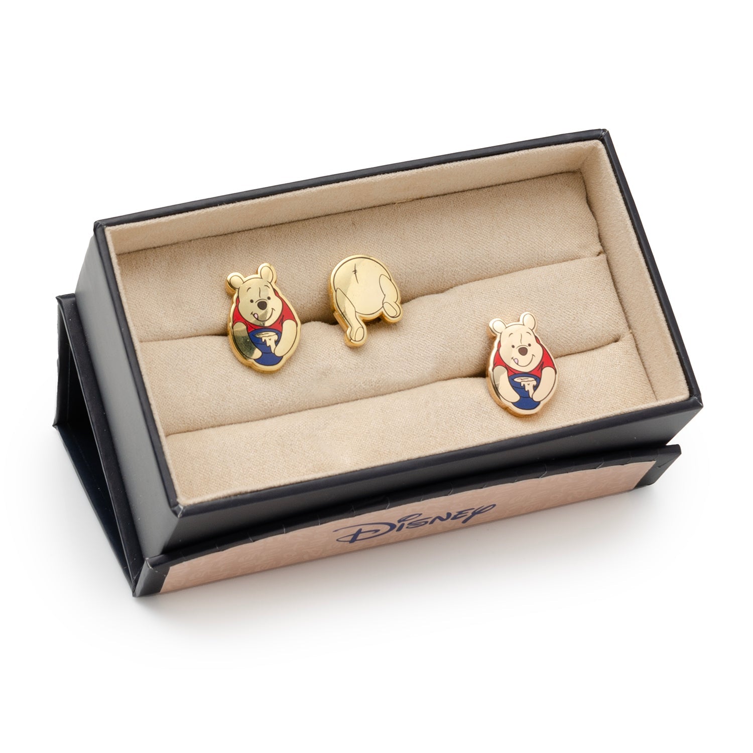 Gold Winnie the Pooh earrings in a Disney box on a white background