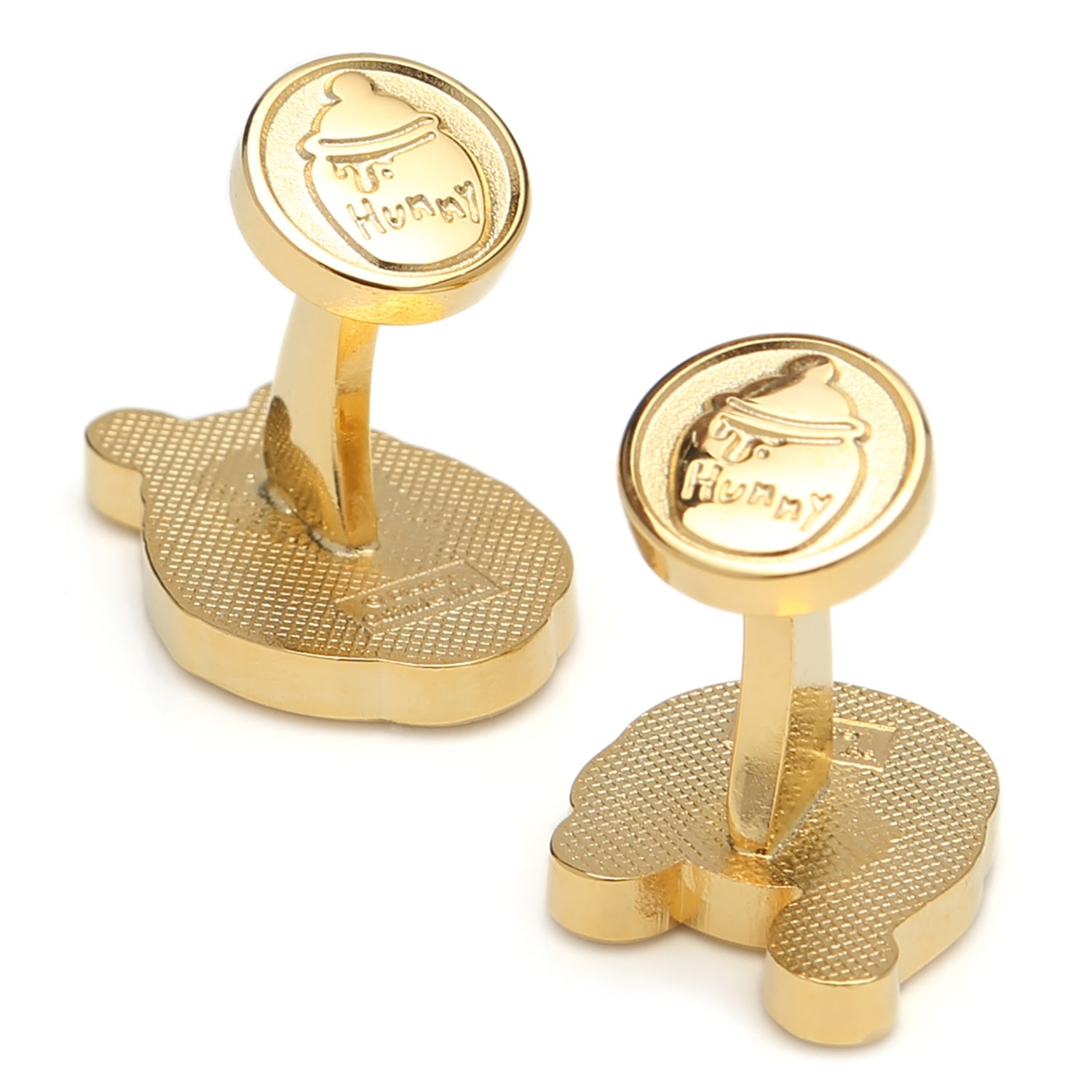 Gold cufflinks with a textured design on a white background