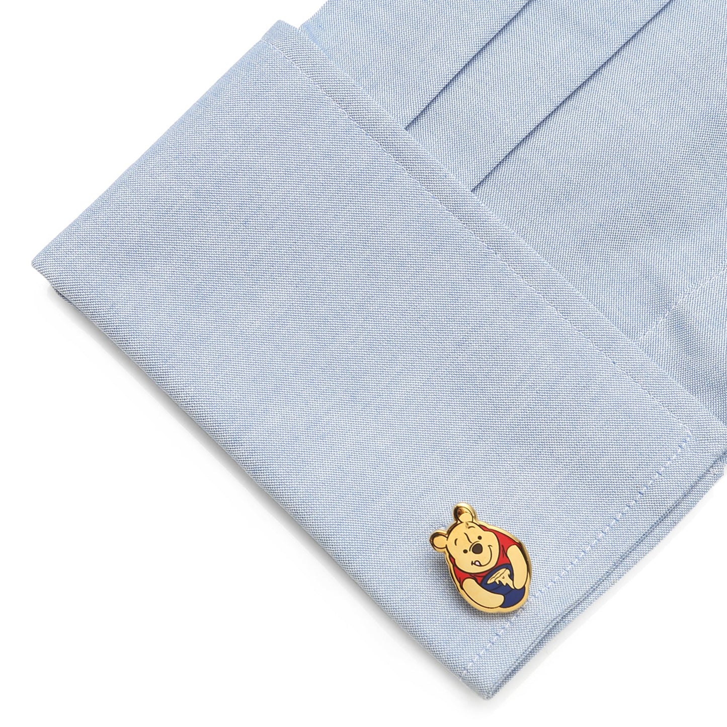 Light blue pocket square with a Winnie the Pooh pin on a white background