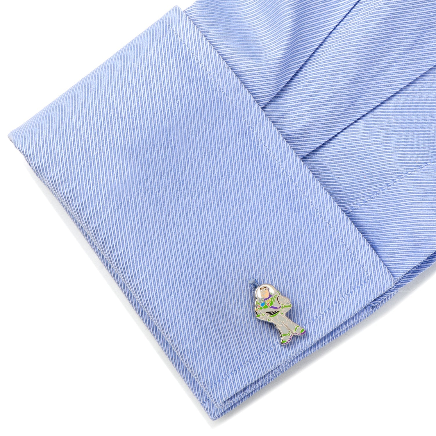 Cufflink on a blue striped shirt with a white background