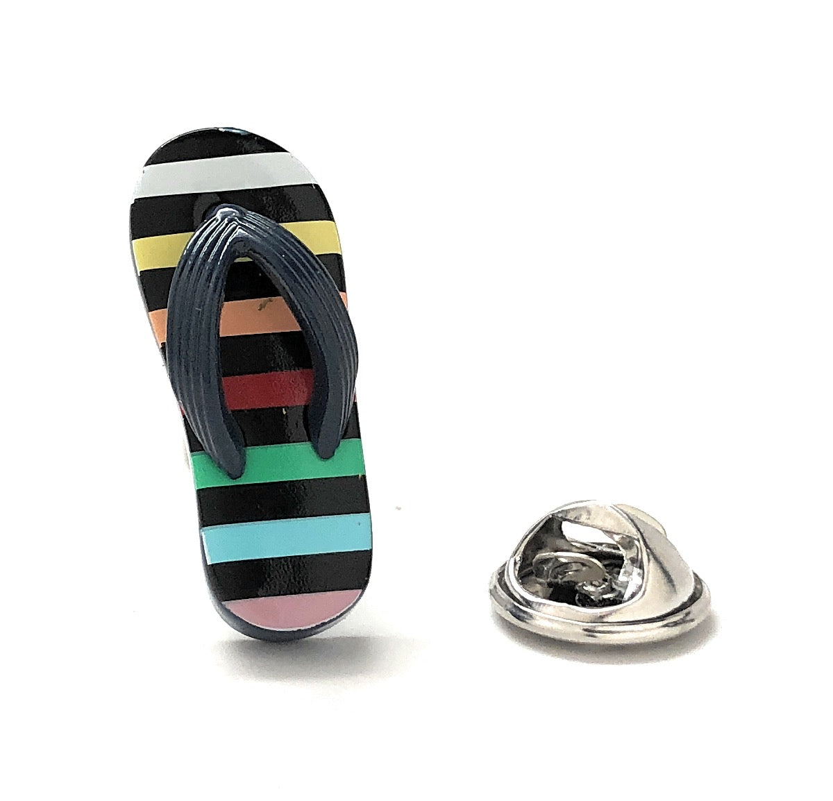 Colorful striped sandal with a matching lapel pin on a white background