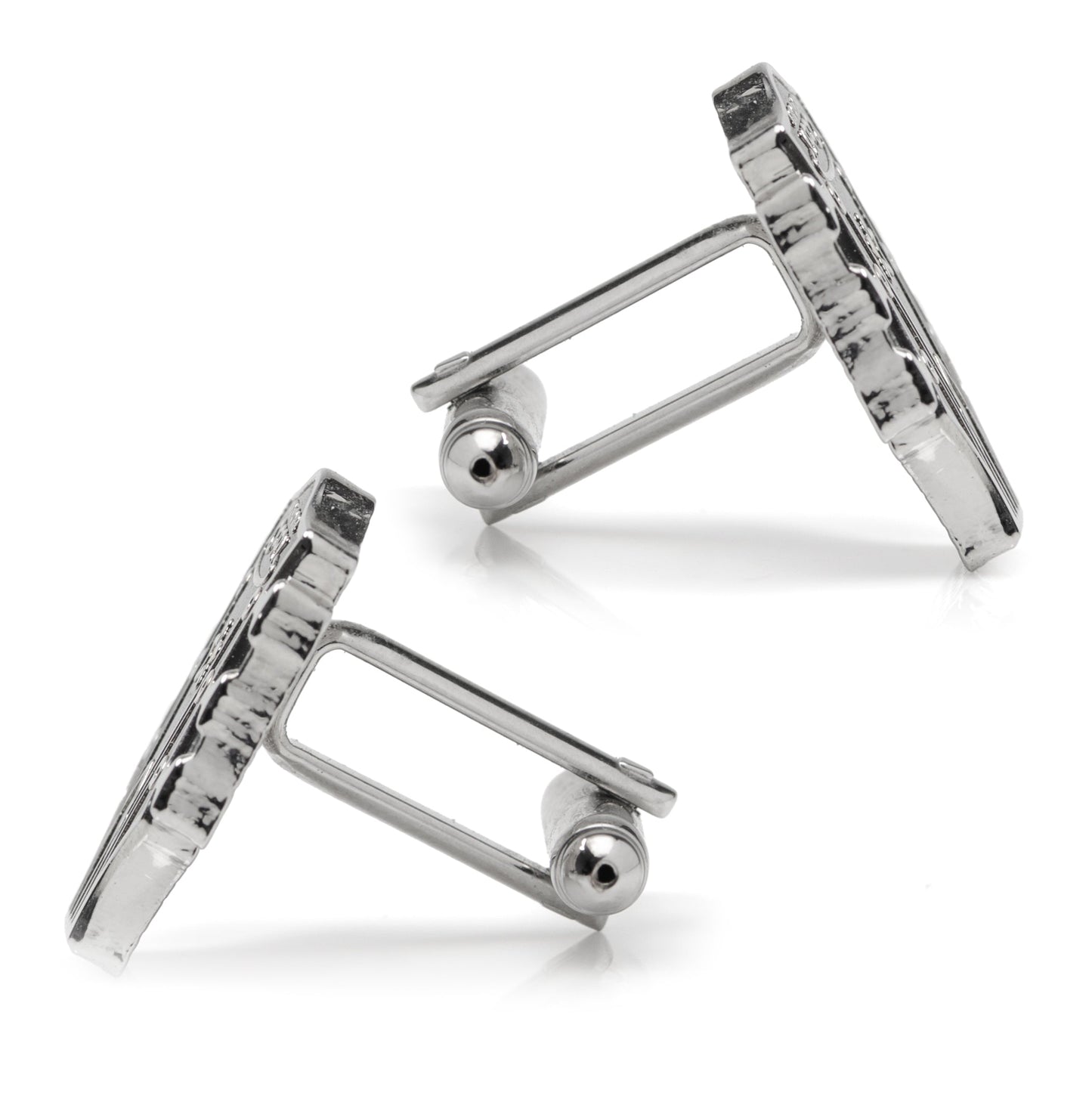 Pair of silver cufflinks on a white background