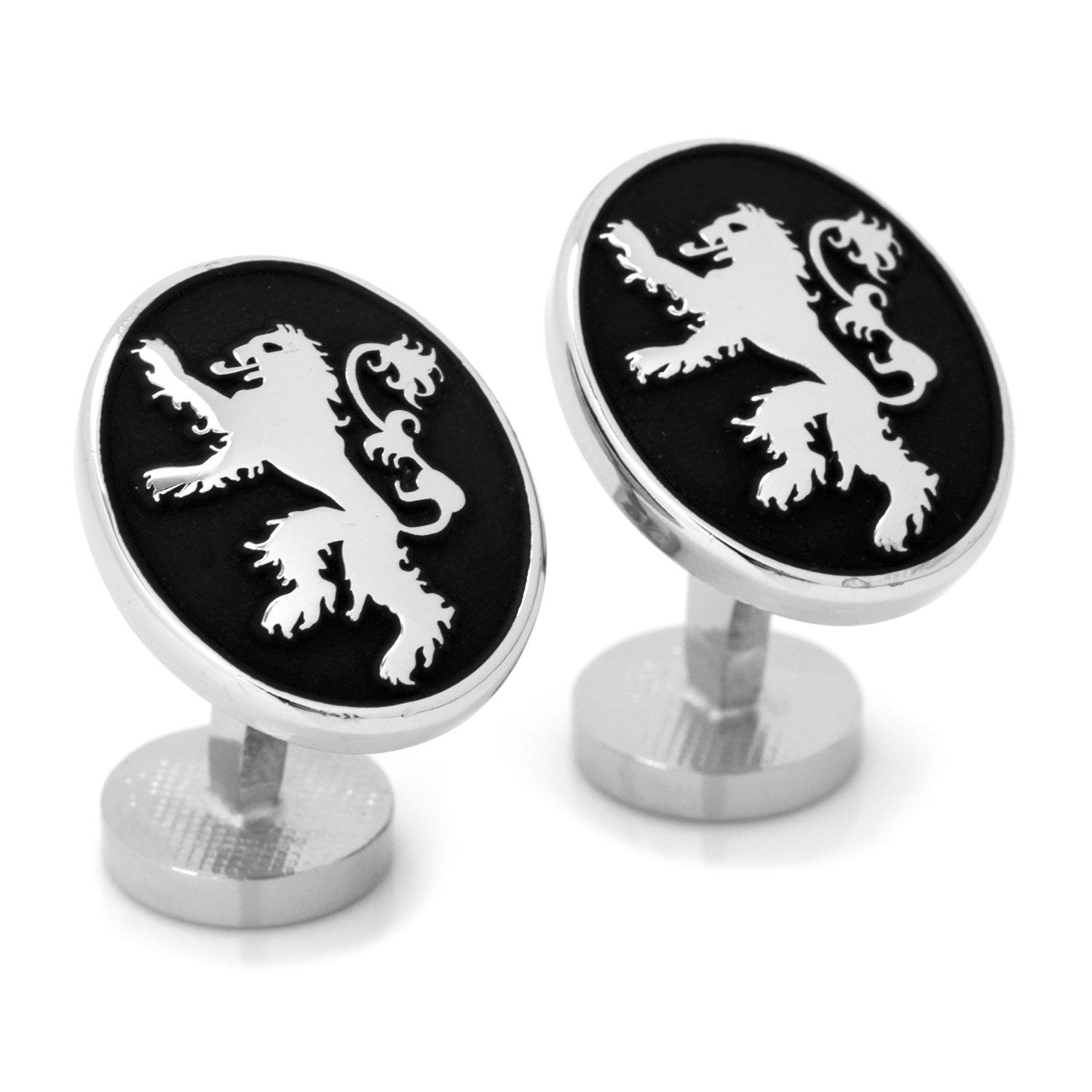 Pair of cufflinks with lion emblem design on a black background
