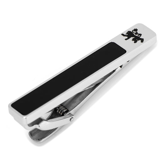 Silver tie clip with black bar and lion emblem on a white background