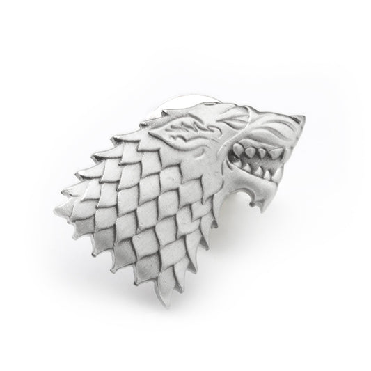 Metallic wolf head emblem with a white background