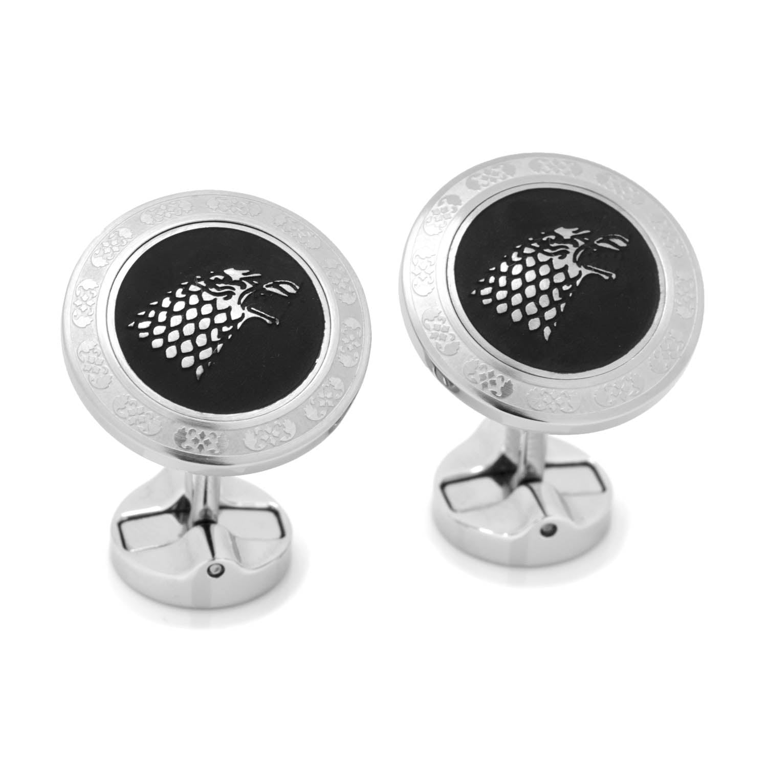 Pair of cufflinks with a black center and silver emblem on a white background