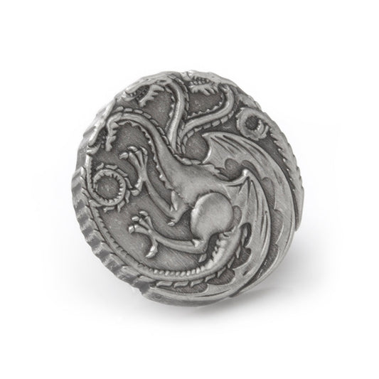 Metallic dragon emblem on a white background