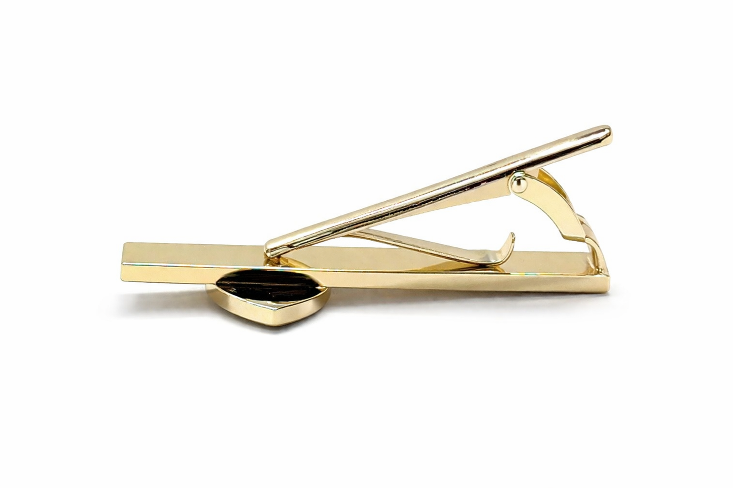 Gold tie clip on a white background side view