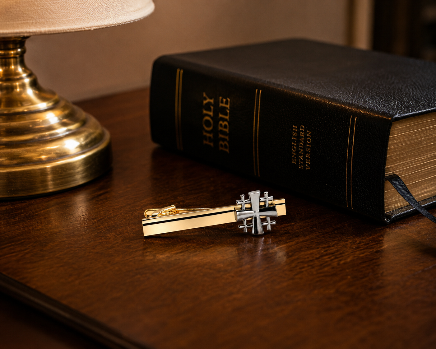 Holy Bible with a decorative key on a wooden surface next to a lamp. Gold and Silver Jerusalem Cross Christian Tie Clip for Men Religious Faith Accessory