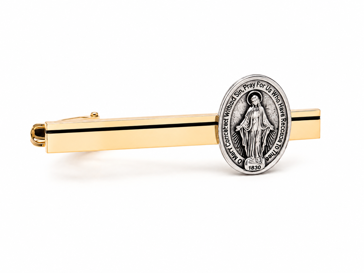 A gold-toned tie clip with a silver-toned Miraculous Medal pendant, shown on a clean white background.