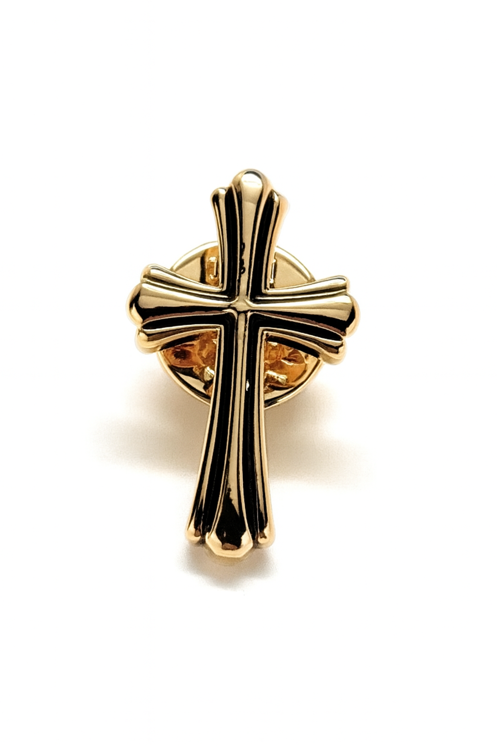 Gold cross pendant on a white background